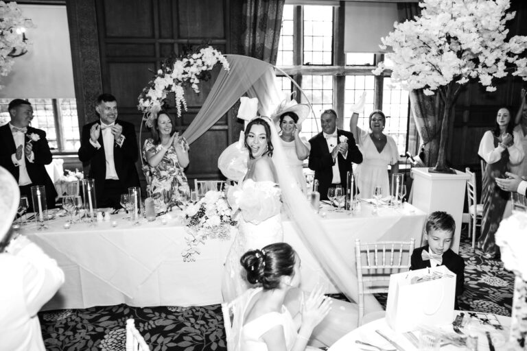 black and white image of bride at inglewood manor house