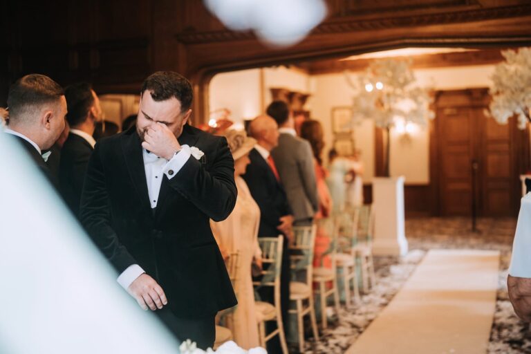 Groom awaiting arrival of bride at inglewood manor house ceremony hall