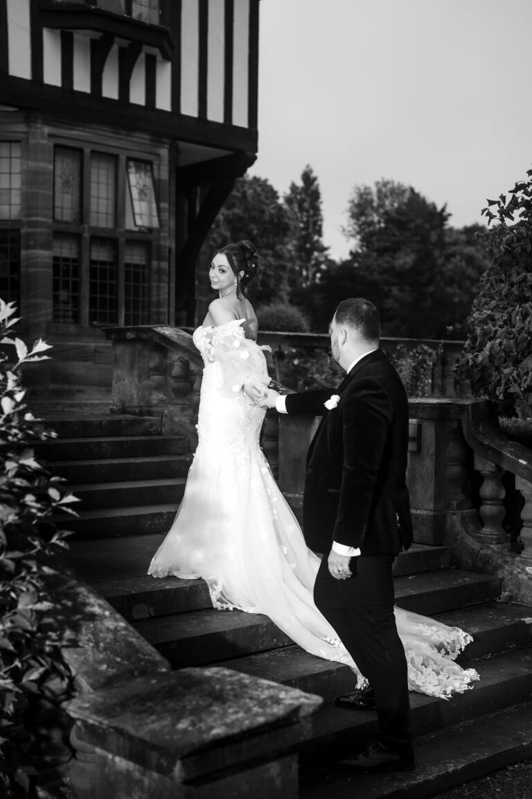 bride and groom walking the steps of inglewood manor house