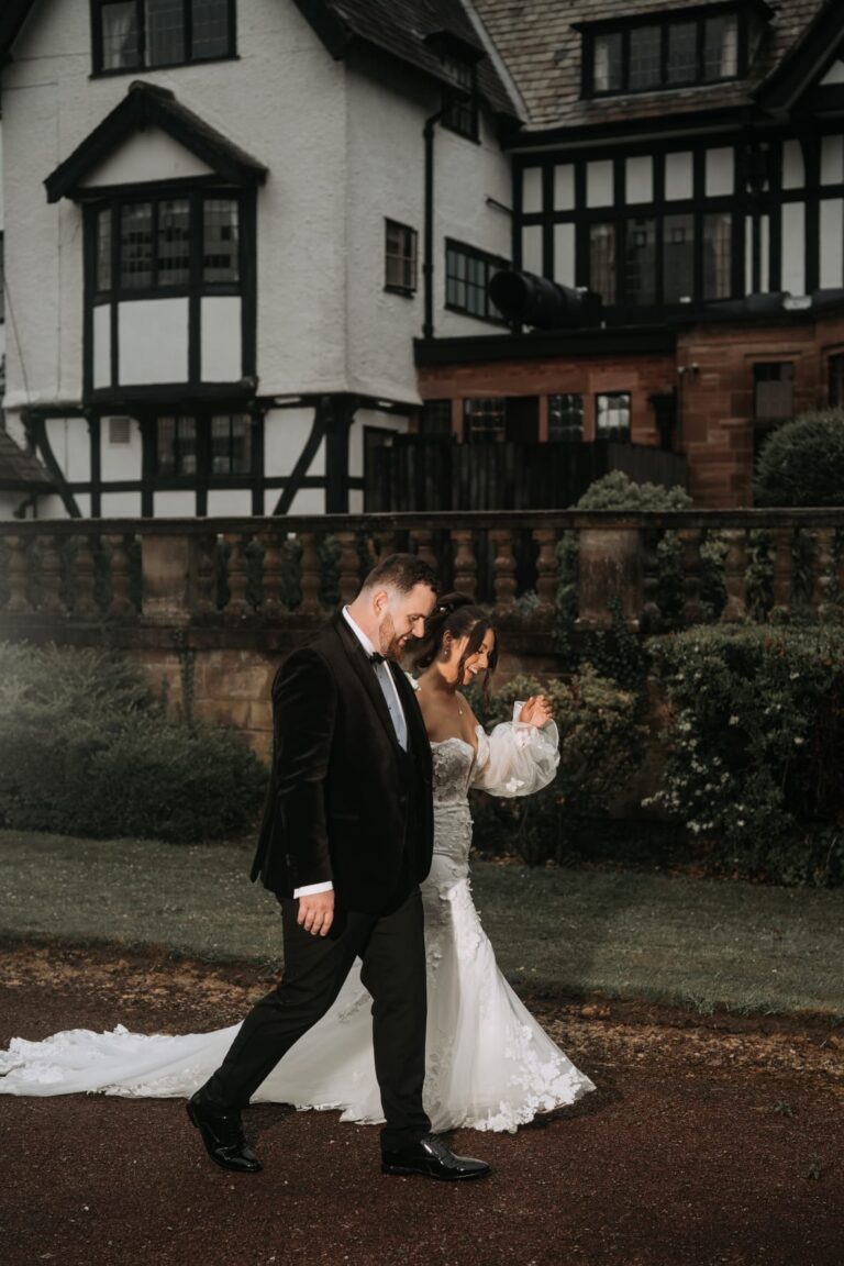 bride and groom walking on the grounds of inglewood manor house wedding venue