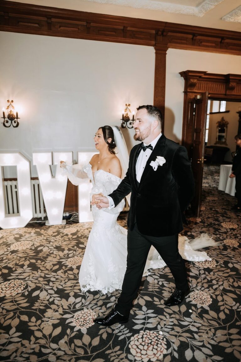 bride and groom entering ceremony hall at inglewood manor house wedding venue